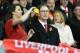 Liverpool's US owner John W. Henry's wife Linda Pizzuti (L) takes a photograph during the English Premier League football match between Liverpool and Southampton at Anfield stadium in Liverpool, north west England on October 25, 2015. AFP PHOTO / OLI SCAR