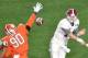 Jan 11, 2016; Glendale, AZ, USA; Alabama Crimson Tide quarterback Jake Coker (14) passes the ball while defended by Clemson Tigers defensive end Shaq Lawson (90) during the first quarter in the 2016 CFP National Championship at University of Phoenix Stadi