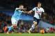 MANCHESTER, ENGLAND - FEBRUARY 14: Erik Lamela of Tottenham Hotspur goes past Nicolas Otamendi of Manchester City during the Barclays Premier League match between Manchester City and Tottenham Hotspur at Etihad Stadium on February 14, 2016 in Manchester,