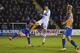 SHREWSBURY, ENGLAND - FEBRUARY 22: Chris Smalling of Manchester United shoots past Nat Knight-Percival of Shrewsbury Town to score their first goal during the Emirates FA Cup fifth round match between Shrewsbury Town and Manchester United at Greenhous Me