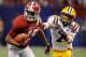 NEW ORLEANS, LA - JANUARY 09: Darius Hanks #15 of the Alabama Crimson Tide runs as Tyrann Mathieu #7 of the Louisiana State University Tigers pulls his jersey from behind during the 2012 Allstate BCS National Championship Game at Mercedes-Benz Superdome