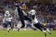 FORT WORTH, TX - OCTOBER 29: Josh Doctson #9 of the TCU Horned Frogs pulls in a pass against KJ Dillon #9 of the West Virginia Mountaineers in the first quarter at Amon G. Carter Stadium on October 29, 2015 in Fort Worth, Texas. (Photo by Tom Pennington