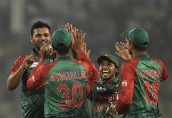 Bangladesh cricket captain Mashrafe Bin Mortaza (L) celebrates with teammates after the dismissal of the United Arab Emirates cricketer Shaiman Anwar during the match between Bangladesh and United Arab Emirates at the Asia Cup T20 cricket tournament at th