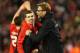 LIVERPOOL, ENGLAND - JANUARY 26: Jurgen Klopp manager of Liverpool and Jon Flanagan of Liverpool celebrate victory in the penalty shoot out after the Capital One Cup semi final second leg match between Liverpool and Stoke City at Anfield on January 26, 2