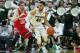 EAST LANSING MI - MARCH 5: Denzel Valentine #45 of the Michigan State Spartans dribbles the ball around Mickey Mitchell #00 of the Ohio State Buckeyes during the first half of the game on March 5, 2016 at the Breslin Center in East Lansing, Michigan. The