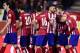 Atletico Madrid's French forward Antoine Griezmann (R) and teammates celebrate after scoring during the Spanish league football match Club Atletico de Madrid vs RC Deportivo La Coruna at the Vicente Calderon stadium in Madrid on March 12, 2016. / AFP / J