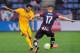Barcelona's Brazilian defender Dani Alves (L) vies with Eibar's forward David Junca (R) during the Spanish league football match SD Eibar vs FC Barcelona at the Ipurua stadium in Eibar on March 6, 2016. / AFP / ANDER GILLENEA (Photo credit should r