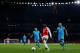 LONDON, ENGLAND - FEBRUARY 23 : Danny Welbeck of Arsenal holds off Jordi Alba and Javier Mascherano of FC Barcelona during the UEFA Champions League match between Arsenal and Barcelona at the Emirates Stadium on February 23, 2016 in London, United Kingdo