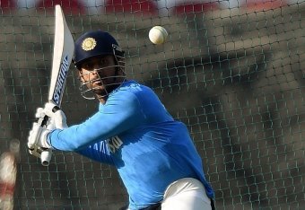 India's captain Mahendra Singh Dhoni plays a shot during the training session at The Vidarbha Cricket Association Stadium in Nagpur on March 14, 2016. 
 India plays against New Zealand in the World T20 cricket tournament on March 15 in Nagpur. / AFP / PUN