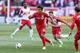 Mar 6, 2016; Harrison, NJ, USA; Toronto FC midfielder Tsubasa Endoh (9) dribbles up field in front of New York Red Bulls midfielder Sacha Kljestan (16) during the first half at Red Bull Arena. Mandatory Credit: Vincent Carchietta-USA TODAY Sports