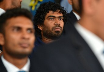 Former Sri Lankan T20 cricket captain Lasith Malinga(C)looks on during a departure ceremony in Colombo on March 8, 2016. 
Sri Lankan cricket Team departure to India for the ICC T20 World Cup Tournament. Defending champions Sri Lanka said Lasith Malinga wa