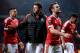 Manchester United's Spanish midfielder Juan Mata (2nd R) reacts as he leaves the pitch after the UEFA Europa League round of 16, second leg football match between Manchester United and Liverpool at Old Trafford in Manchester, north west England on March 1