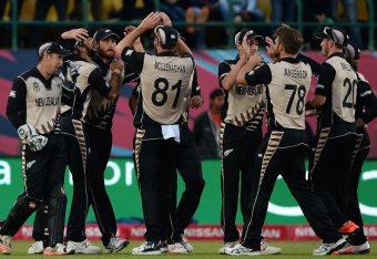 New Zealand's cricketers celebrate after victory in the World T20 cricket tournament match between Australia and New Zealand at The Himachal Pradesh Cricket Association Stadium (HPCA) in Dharamsala on March 18, 2016.
 / AFP / SAJJAD HUSSAIN        (Photo 