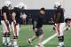 Auburn OL coach Herb Hand (center)