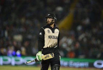 New Zealand's Martin Guptill leaves the ground after his dismissal during the World T20 cricket match between New Zealand and Pakistan at the Punjab Cricket Stadium Association Stadium in Mohali on March 22, 2016. / AFP / MONEY SHARMA        (Photo credit