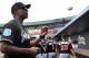Mar 3, 2016; Jupiter, FL, USA; Miami Marlins hitting coach Barry Bonds (25) signed an autograph baseball before a spring training game against the St. Louis Cardinals at Roger Dean Stadium. Mandatory Credit: Steve Mitchell-USA TODAY Sports