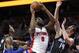 Mar 23, 2016; Auburn Hills, MI, USA; Detroit Pistons center Andre Drummond (0) grabs the loose ball in front of Orlando Magic guard Elfrid Payton (L) and forward Jason Smith (14) during the fourth quarter at The Palace of Auburn Hills. The Pistons won 118