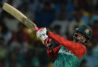 Bangladesh batsman Tamim Iqbal Khan plays a shot during the World T20 cricket tournament match between India and Bangladesh at The Chinnaswamy Stadium in Bangalore on March 23, 2016.
Bangladesh is chasing a target of 146 runs scored by India with a loss