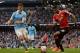 Manchester City's Argentinian defender Martin Demichelis (L) vies with Manchester United's English striker Marcus Rashford during the English Premier League football match between Manchester City and Manchester United at the Etihad Stadium in Manchester,