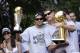 SAN ANTONIO - JUNE 17: Tony Parker #9 of the San Antonio Spurs holds up his MVP Trophy with teammate Brent Barry #17, who's holding up a championship trophy, during the Spurs Championship Parade held on the Riverwalk on June 17, 2007 in San Antonio, Texas