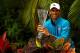 Novak Djokovic poses with the trophy after winning the Miami Open.