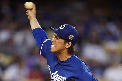 Japanese right-hand pitcher Kenta Maeda, wearing No. 18, speaks during his  introductory press conference at Dodger Stadium in Los Angenles on Jan. 7,  2016. The former Hiroshima Carp ace made the official