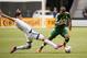 VANCOUVER, BC - MARCH 28: Darlington Nagbe #6 of the Portland Timbers avoids the tackle of Matias Laba #15 of the Vancouver Whitecaps FC in MLS action on March, 28, 2015 at BC Place Stadium in Vancouver, British Columbia, Canada. (Photo by Rich Lam/Getty