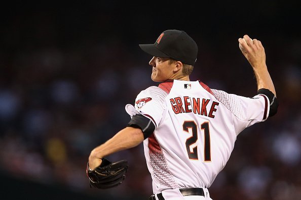 Arizona Diamondbacks starting pitcher Zack Greinke wipes his