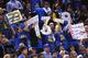 OAKLAND, CA - APRIL 13: Golden State Warriors fans hold signs in the second half during the game between the Memphis Grizzlies and the Golden State Warriors at ORACLE Arena on April 13, 2016 in Oakland, California. By defeating the Memphis Grizzlies, the