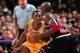 INGLEWOOD, CA - FEBRUARY 5: Michael Jordan #23 of the Chicago Bulls drives against Kobe Bryant #8 of the Los Angeles Lakers on February 5, 1997 at the Great Western Forum in Inglewood, California. NOTE TO USER: User expressly acknowledges and agrees that,