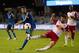 Apr 13, 2016; San Jose, CA, USA; San Jose Earthquakes forward Chris Wondolowski (8) kicks the ball against New York Red Bulls midfielder Felipe Martins (8) during the second half at Avaya Stadium. The San Jose Earthquakes defeated the New York Red Bulls 2