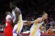 LOS ANGELES, CA - DECEMBER 25: Stephen Curry #30 of the Golden State Warriors dribbles around a pick by teammate Draymond Green #23 as Chris Paul #3 of the Los Angeles Clippers runs into Green in the second half during the NBA game at Staples Center on D