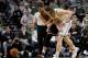 BOSTON, MA - APRIL 26: Kevin Love #0 of the Cleveland Cavaliers injures his shoulder as he chases a loose ball against Kelly Olynyk #41 of the Boston Celtics in the first half in Game Four during the first round of the 2015 NBA Playoffs on April 26, 2015