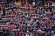 Atletico's footdball club supporters hold a club's scarves during the Spanish league football match Atletico de Madrid vs Granada CF at the Vicente Calderon stadium in Madrid on April 17, 2016. / AFP / GERARD JULIEN (Photo credit should read GERARD