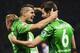 Moenchengladbach's Norwegian midfielder Havard Nordtveit (R) celebrates scoring his side's 4th goal with team mate Moenchengladbach's Swiss midfielder Granit Xhaka during the German first division Bundesliga football match Hertha Berlin vs Borussia Moench