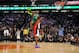PHOENIX - FEBRUARY 14: (Sequence 3 of 6) Nate Robinson #4 of the New York Knicks jumps over Dwight Howard #12 of the Orlando Magic on a dunk attempt during the Sprite Slam Dunk Contest on All-Star Saturday Night, part of 2009 NBA All-Star Weekend at US A