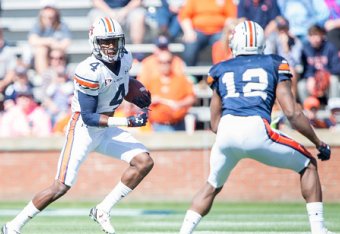 AUBURN, AL - APRIL 9: Wide receiver Jason Smith #4 of the Auburn Tigers looks to maneuver by wide receiver Jamel Dean #12 of the Auburn Tigers at Jordan Hare Stadium on April 9, 2016 in Auburn, Alabama. (Photo by Michael Chang/Getty Images)