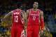 Apr 27, 2016; Oakland, CA, USA; Houston Rockets guard James Harden (13) and center Dwight Howard (12) between plays during the third quarter in game five of the first round of the NBA Playoffs at Oracle Arena. Mandatory Credit: Kelley L Cox-USA TODAY Spor