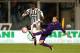 FLORENCE, ITALY - APRIL 24: Patrice Evra of Juventus FC in action against Federico Bernardeschi of ACF Fiorentina during the Serie A match between ACF Fiorentina and Juventus FC at Stadio Artemio Franchi on April 24, 2016 in Florence, Italy. (Photo by Ga