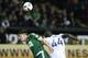 Feb 24, 2016; Portland, OR, USA; Portland Timbers midfielder Ben Zemanski (14) reacts after Vancouver Whitecaps FC defender Pa Modou Kah (44) heads the all over him at Providence Park. Mandatory Credit: Jaime Valdez-USA TODAY Sports