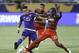 Apr 3, 2016; Orlando, FL, USA; Portland Timbers midfielder Diego Chara (21) and Orlando City FC midfielder Darwin Ceren (17) battle for the ball as defender Jermaine Taylor (back) follows behind during the second half of a soccer match at Orlando Citrus B