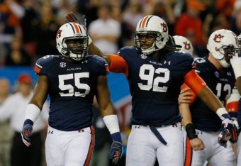 ATLANTA, GA - DECEMBER 07:  Carl Lawson #55 of the Auburn Tigers celebrates a sack with teammate Kenneth Carter #92 in the second quarter against the Missouri Tigers during the SEC Championship Game at Georgia Dome on December 7, 2013 in Atlanta, Georgia.