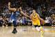 OAKLAND, CA - APRIL 05: Stephen Curry #30 of the Golden State Warriors drives on Karl-Anthony Towns #32 of the Minnesota Timberwolves at ORACLE Arena on April 5, 2016 in Oakland, California. NOTE TO USER: User expressly acknowledges and agrees that, by d