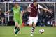 Apr 23, 2016; Commerce City, CO, USA; Colorado Rapids midfielder Shkelzen Gashi (11) dribbles the ball ahead of Seattle Sounders midfielder Osvaldo Alonso (6) in the first half at Dick's Sporting Goods Park. The Rapids defeated the Sounders 3-1. Mandatory