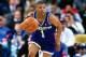 AUBURN HILLS, MI: - 1995: Mugsy Bogues #1 of the Charlotte Hornets drives against the Detroit Pistons circa 1995 at the Palace of Auburn Hills in Auburn Hills, MI. NOTE TO USER: User expressly acknowledges and agrees that, by downloading and or using this