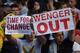 Arsenal fans hold up signs calling for the resignation of Arsenal's French manager Arsene Wenger after the English Premier League football match between Manchester City and Arsenal at the Etihad Stadium in Manchester, north west England, on May 8, 2016. /