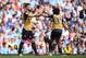 MANCHESTER, ENGLAND - MAY 08: Olivier Giroud of Arsenal (L) celebrates scoring his side's first goal with Mohamed Elneny of Arsenal during the Barclays Premier League match between Manchester City and Arsenal at the Etihad Stadium on May 8, 2016 in Manch