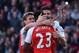Arsenal's French striker Olivier Giroud (R) congratulates Arsenal's English striker Danny Welbeck (C) after Arsenal's English striker Danny Welbeck scored the opening goal during the English Premier League football match between Arsenal and Norwich at the