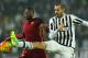 TURIN, ITALY - JANUARY 24: Giorgio Chiellini (R) of Juventus FC competes for the ball with Sadiq Umar (L) of AS Roma during the Serie A match between Juventus FC and AS Roma at Juventus Arena on January 24, 2016 in Turin, Italy. (Photo by Marco Luzzani/