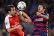 Arsenal's French midfielder Mathieu Flamini (L) vies with Barcelona's Uruguayan forward Luis Suarez during the UEFA Champions League Round of 16 second leg football match FC Barcelona vs Arsenal FC at the Camp Nou stadium in Barcelona on March 16, 2016.